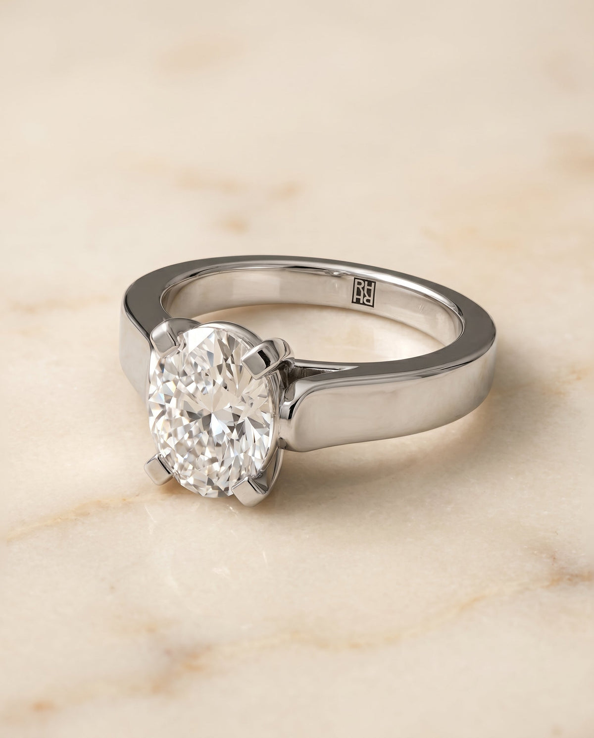 Charlotte Select Cathedral Solitaire Oval Lab Diamond Engagement Ring in 18K White Gold, shown on hand, angled | RockHer
