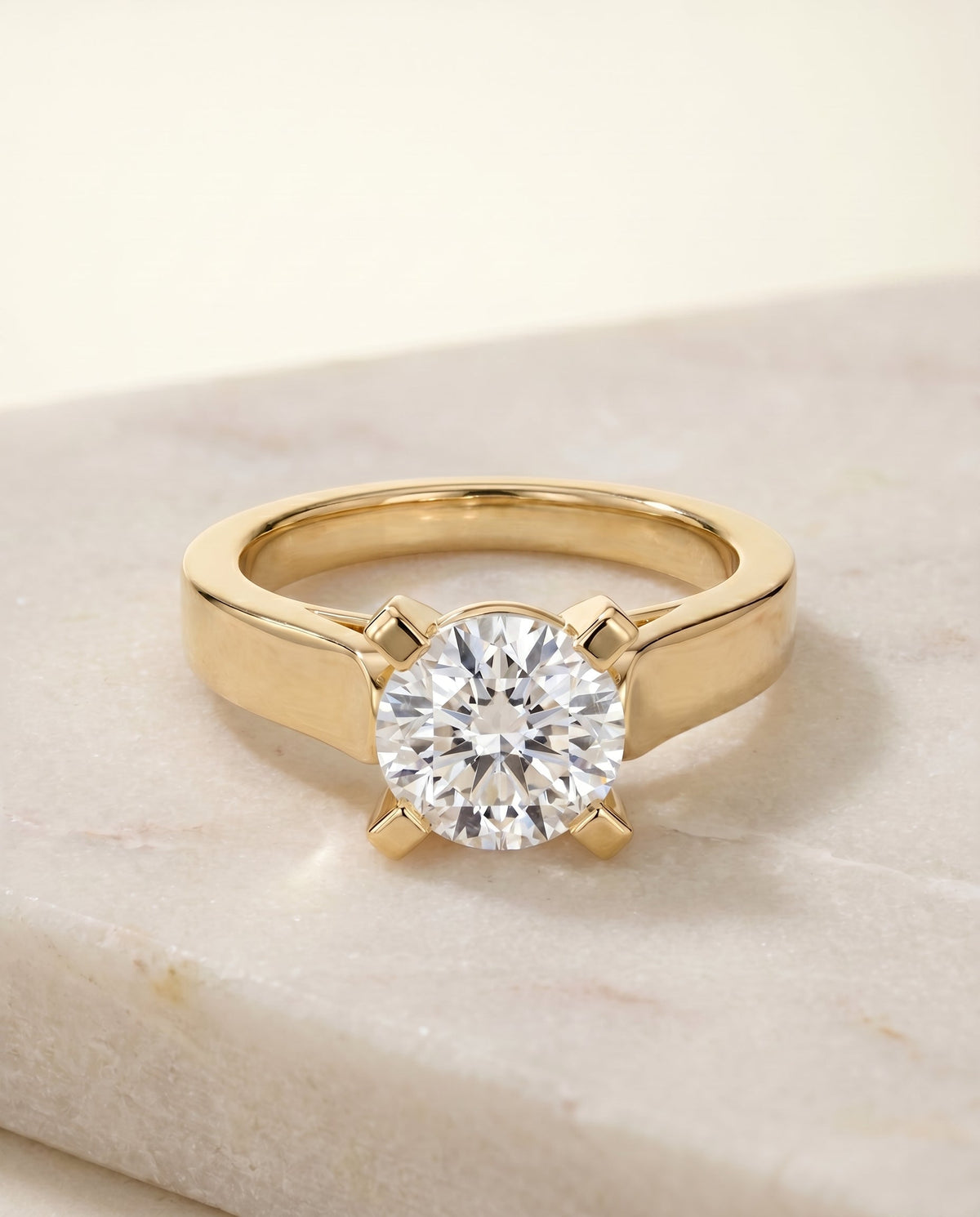 Charlotte Select Cathedral Solitaire Round Lab Diamond Engagement Ring in 18K Yellow Gold, shown on hand, angled | RockHer