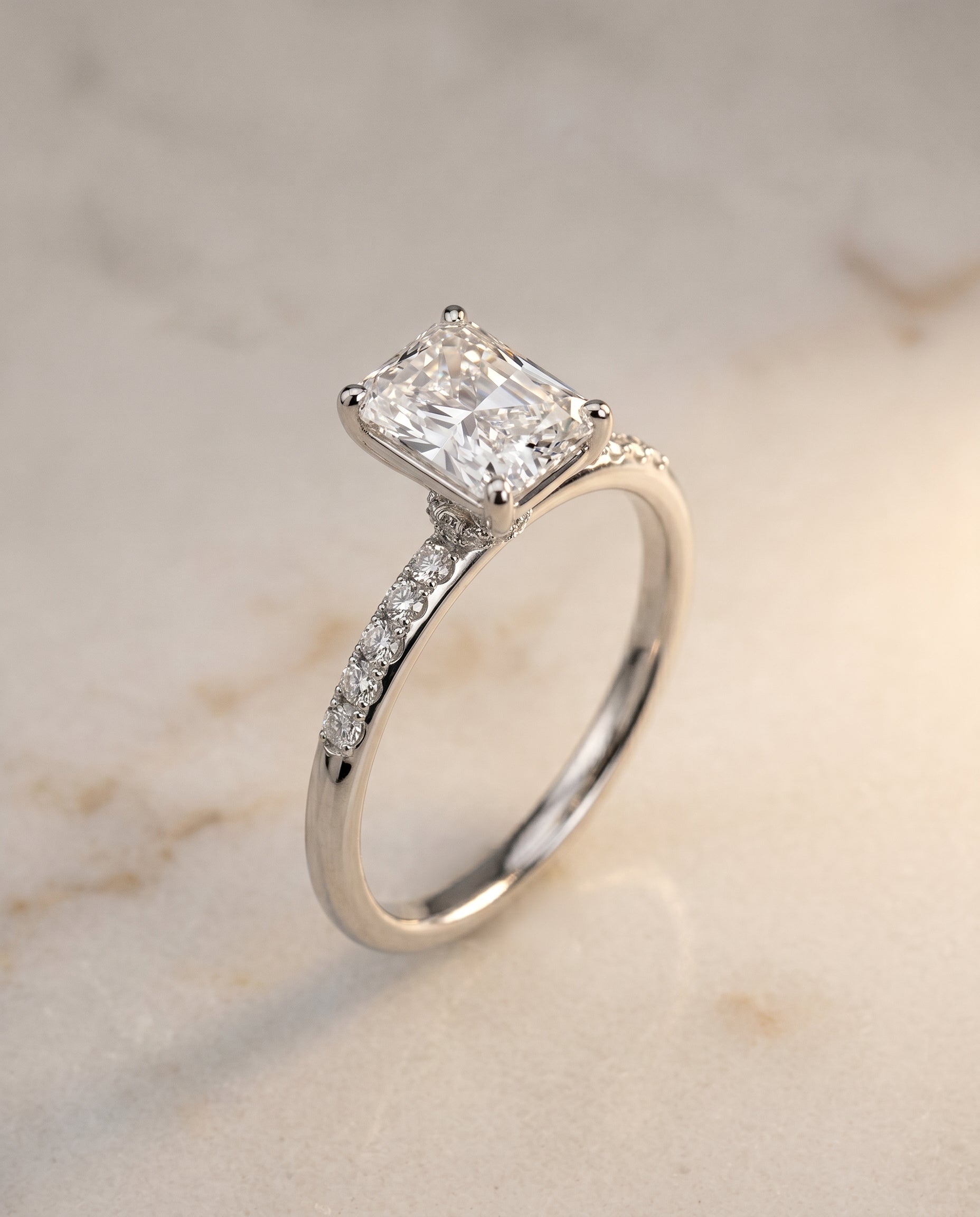 Hidden Halo Pavé Solitaire Cut styling on The Cherie emerald engagement ring setting | RockHer