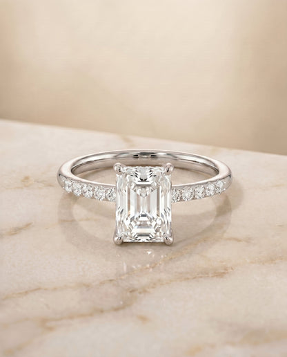 Cherie Select Hidden Halo Pavé Solitaire Radiant Cut Lab Diamond Engagement Ring in 18K White Gold, shown on hand, angled | RockHer