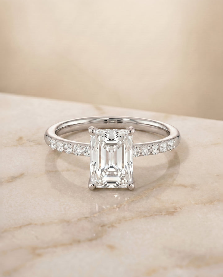 Cherie Select Hidden Halo Pavé Solitaire Radiant Cut Lab Diamond Engagement Ring in Platinum, shown on hand, angled | RockHer