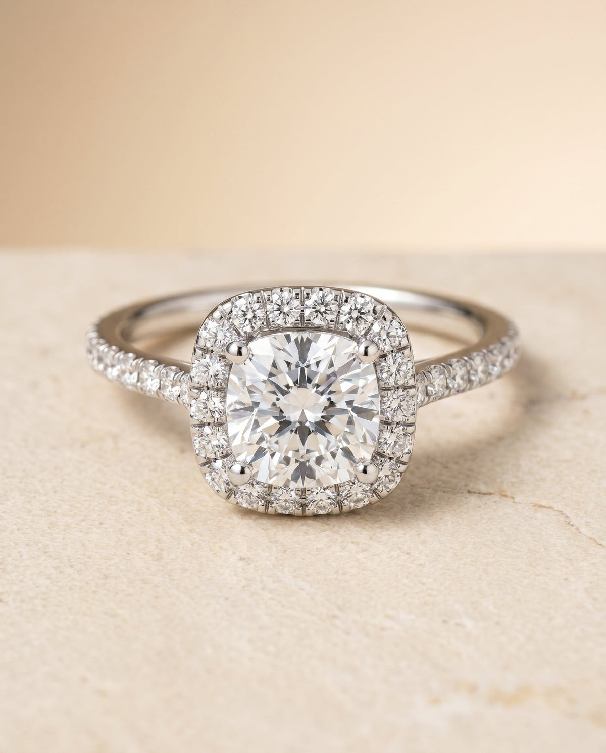 Cosette Select Pavé Halo Cushion Cut Lab Diamond Engagement Ring in 18K White Gold, shown on hand, angled | RockHer