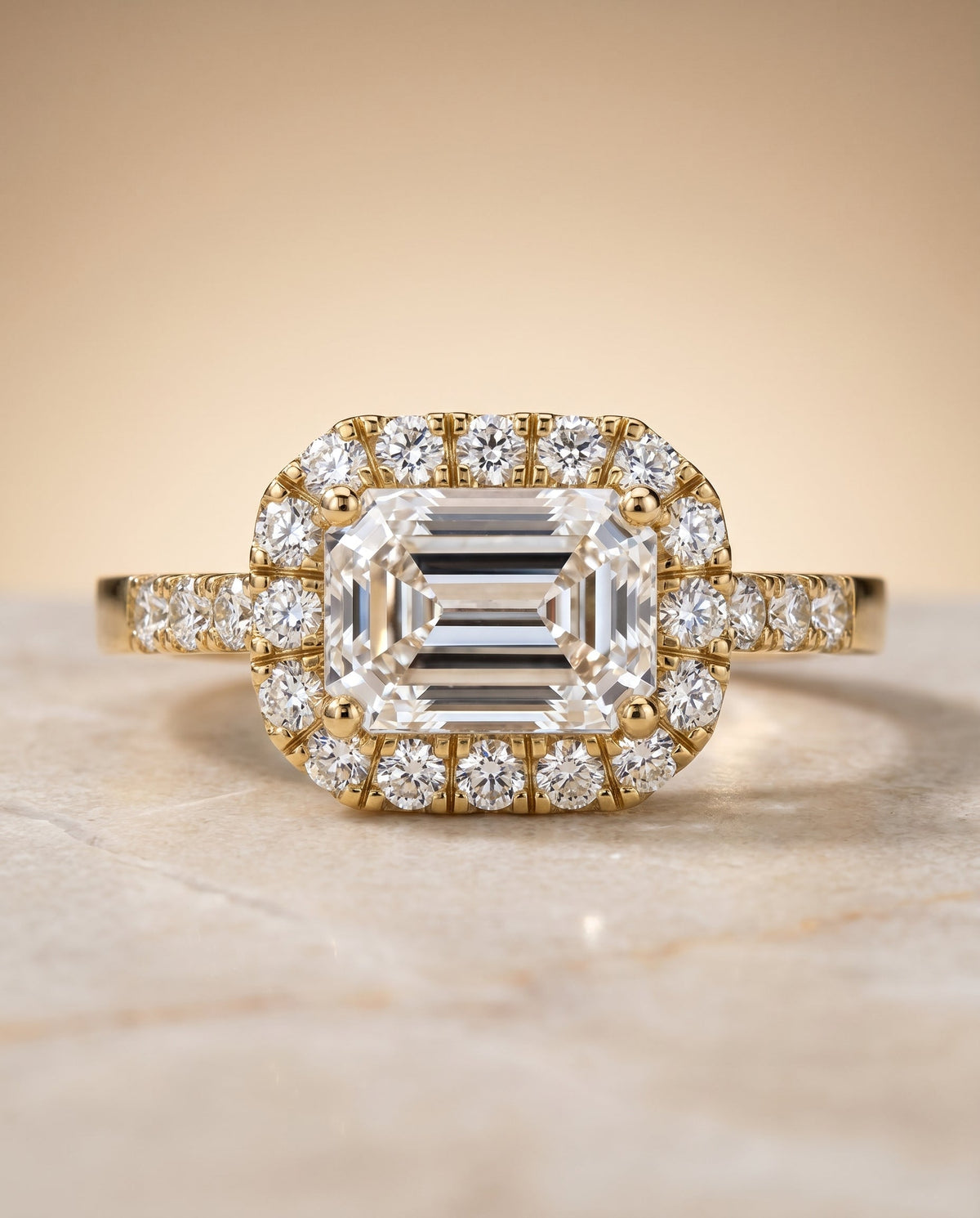Crimson Select Halo Emerald Cut Lab Diamond Engagement Ring in 18K Yellow Gold, shown on hand, angled | RockHer