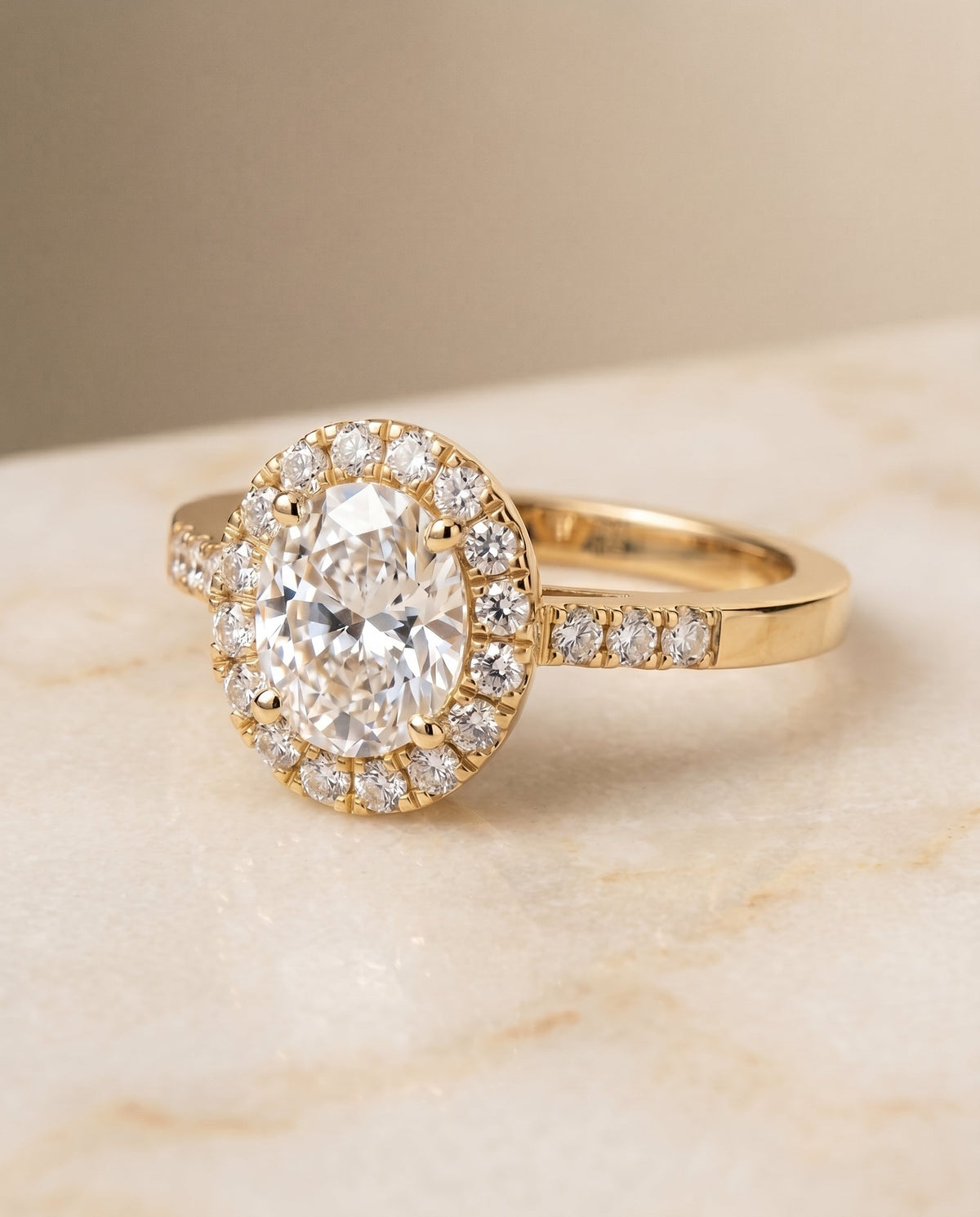 Crimson Select Halo Oval Lab Diamond Engagement Ring in 18K Yellow Gold, shown on hand, angled | RockHer