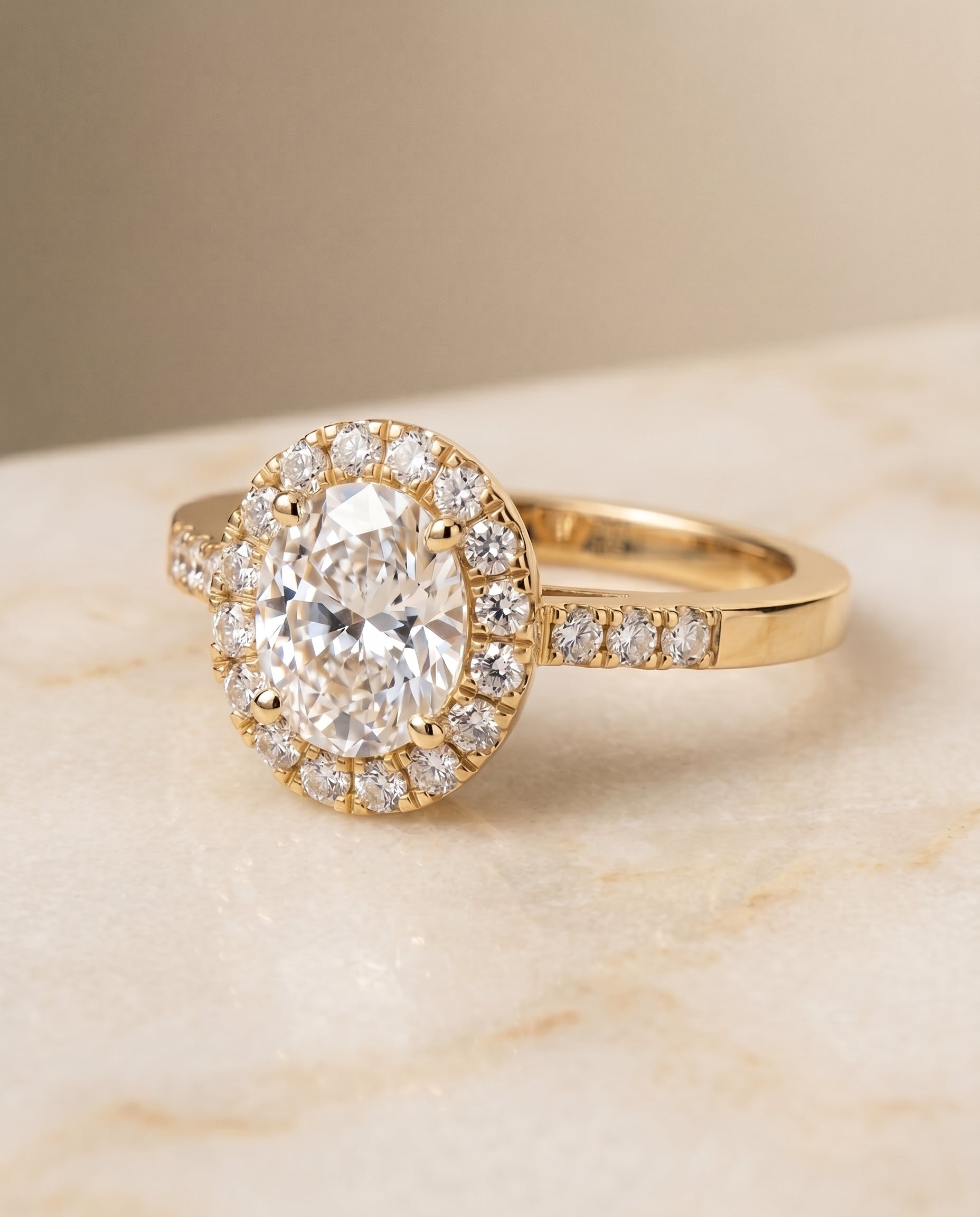 The Crimson East West Pavé Halo Engagement Ring Setting for Oval Diamonds in 18K Yellow Gold