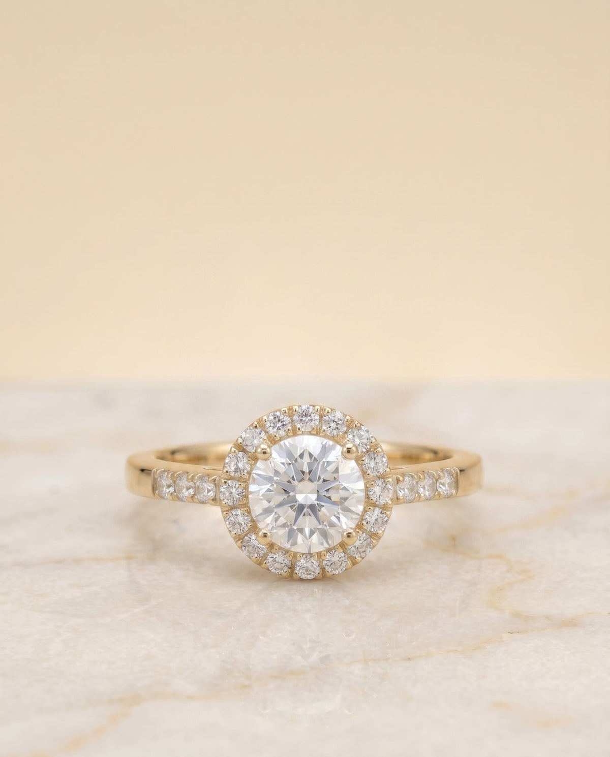 Crimson Select Halo Round Lab Diamond Engagement Ring in 18K Yellow Gold, shown on hand, angled | RockHer
