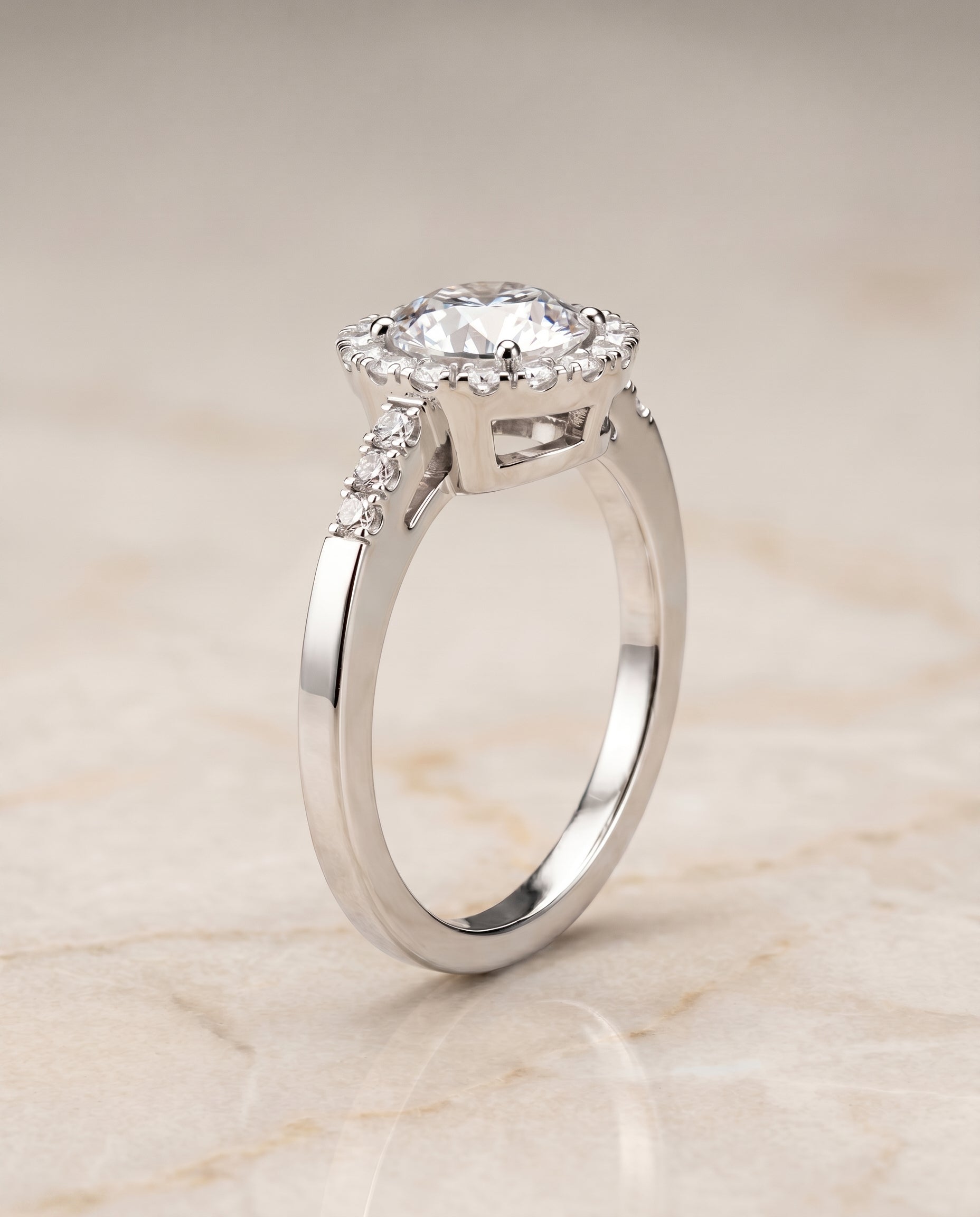 Crimson Select Halo Round Lab Diamond Engagement Ring in 18K White Gold, shown on hand, angled | RockHer