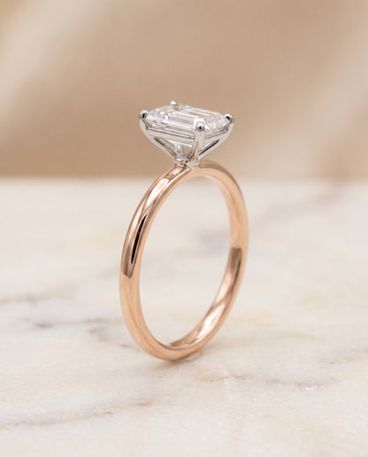 The Cyndi Curved Hidden Halo Solitaire Emerald Cut Engagement Ring Setting in 14K Rose Gold