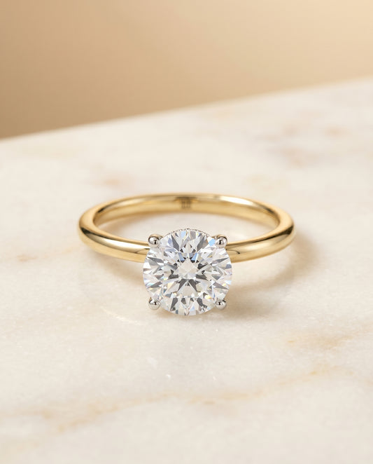 The Cyndi Hidden Halo Solitaire Engagement Ring Setting for Round Diamonds in 18K Yellow Gold | RockHer