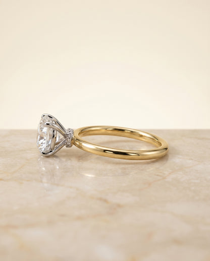 The Cyndi Curved Hidden Halo Solitaire Round Engagement Ring Setting in 18K Yellow Gold