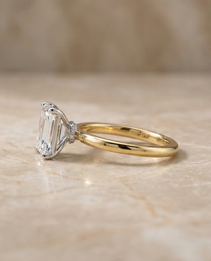 The Cyndi Curved Hidden Halo Solitaire Emerald Cut Engagement Ring Setting in 18K Yellow Gold