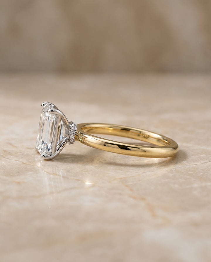The Cyndi Hidden Halo Solitaire Engagement Ring Setting for Emerald Cut Diamonds in 18K Yellow Gold