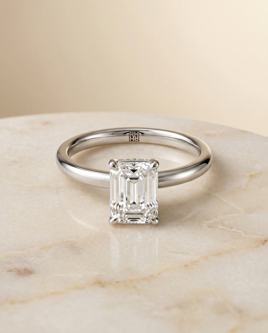 The Cyndi Hidden Halo Solitaire Engagement Ring Setting for Emerald Cut Diamonds in Platinum