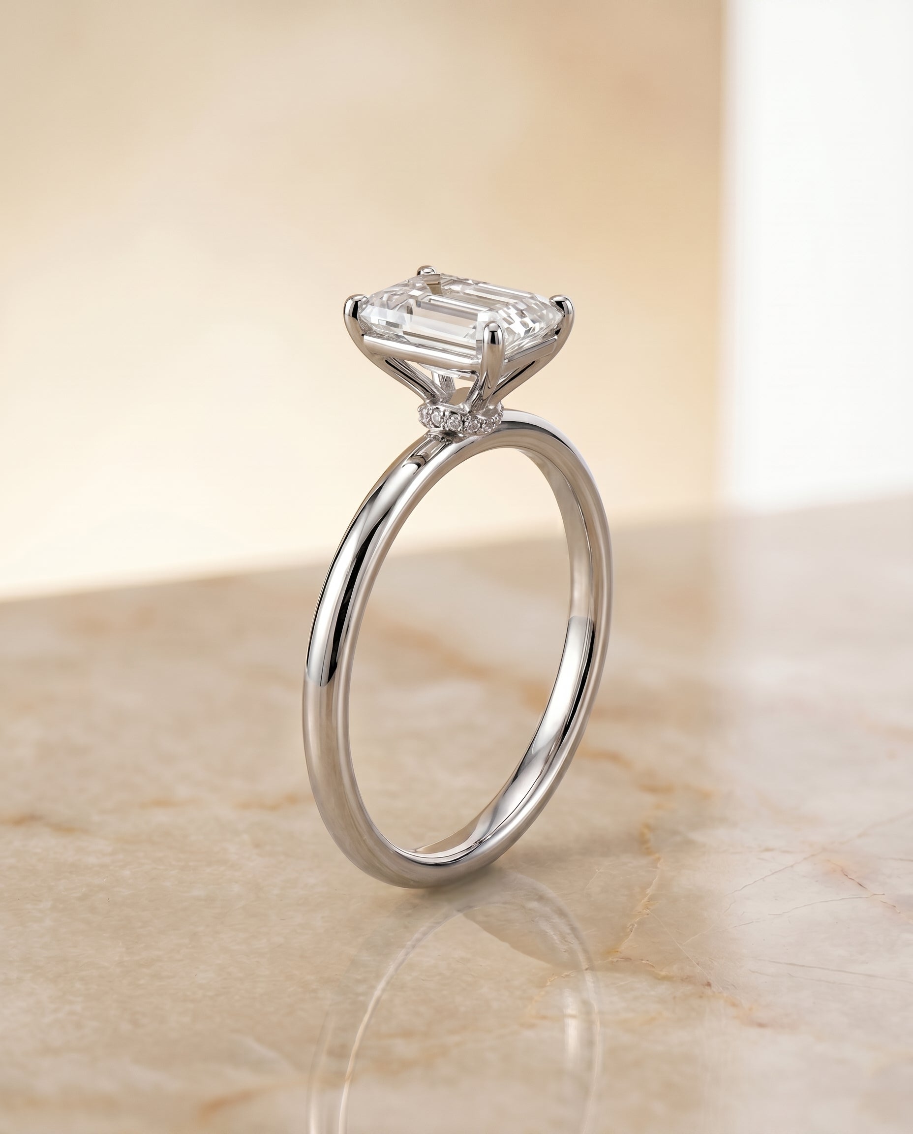 Curved Hidden Halo Solitaire Cut styling on The Cyndi emerald engagement ring setting | RockHer