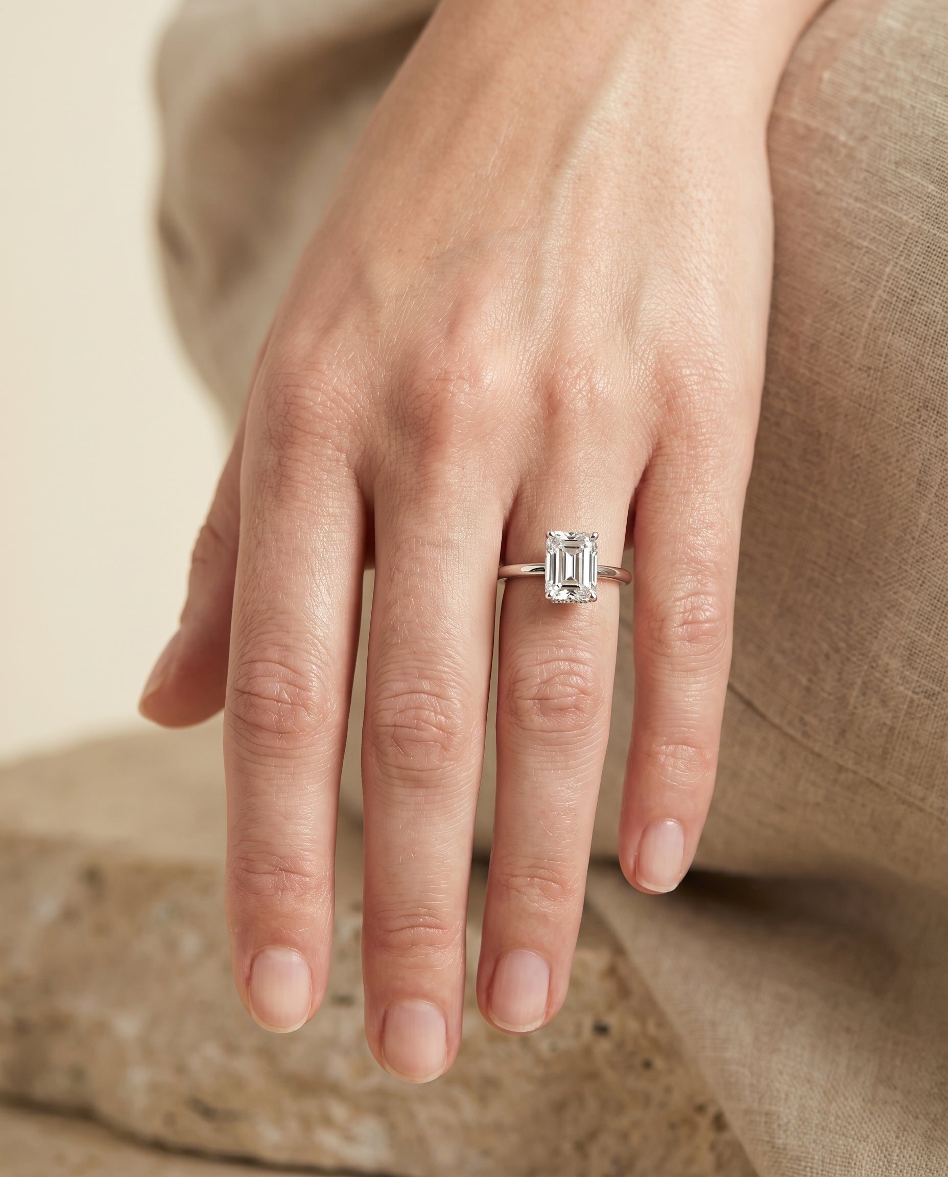 The Cyndi engagement ring setting in 18K White Gold, curved hidden halo solitaire cut design | RockHer