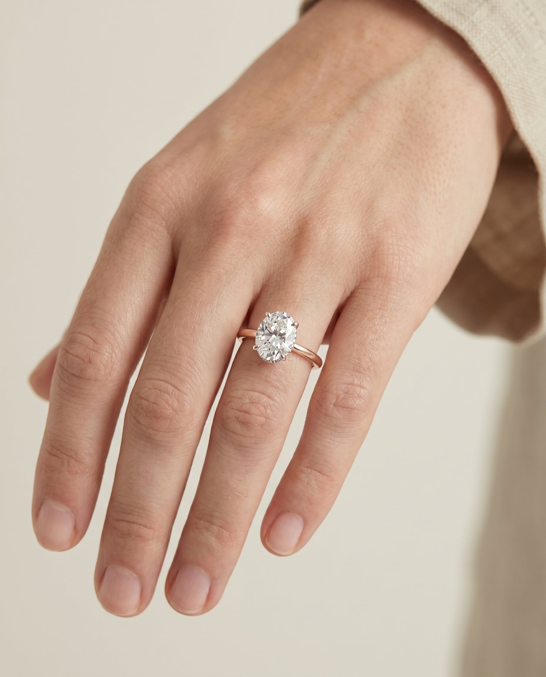 The Cyndi engagement ring setting in 14K Rose Gold, curved hidden halo solitaire design | RockHer