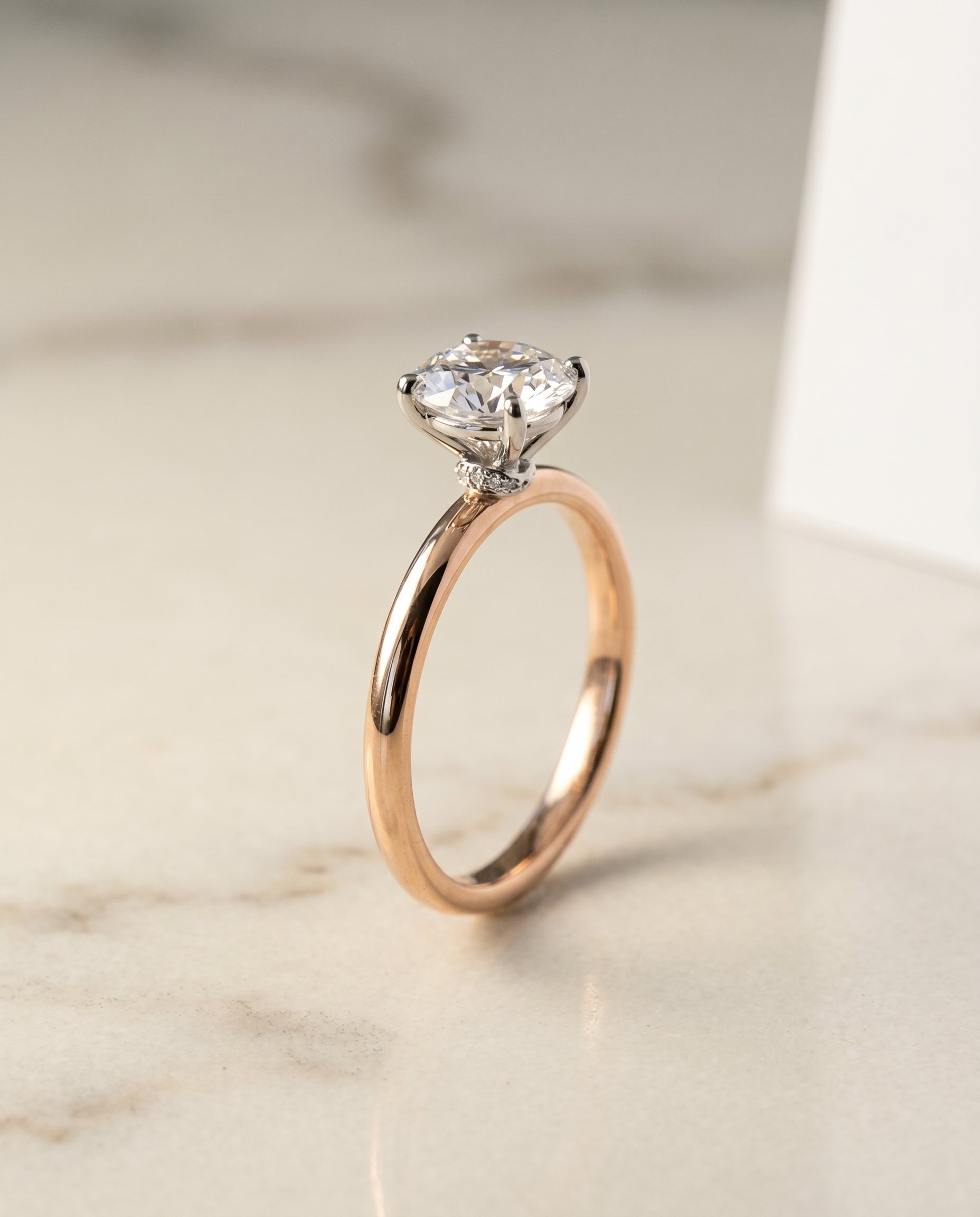 Curved Hidden Halo Solitaire styling on The Cyndi round engagement ring setting | RockHer