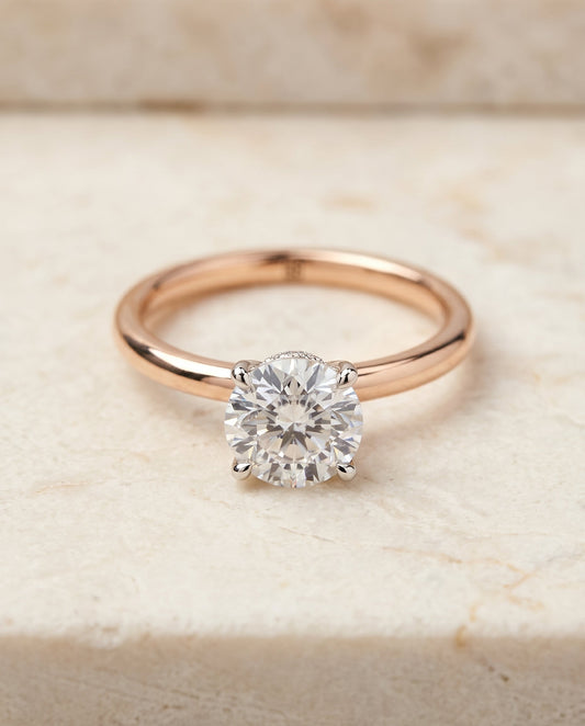 Cyndi Select Solitaire Round Lab Diamond Engagement Ring in 14K Rose Gold, shown on hand, angled | RockHer