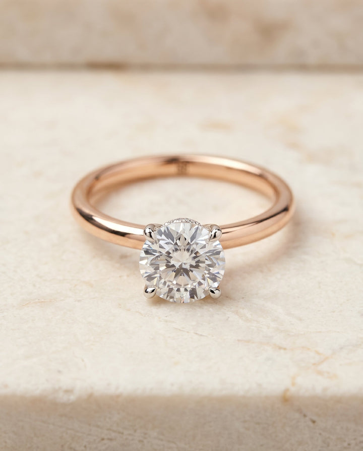 Cyndi Select Solitaire Round Lab Diamond Engagement Ring in 14K Rose Gold, shown on hand, angled | RockHer