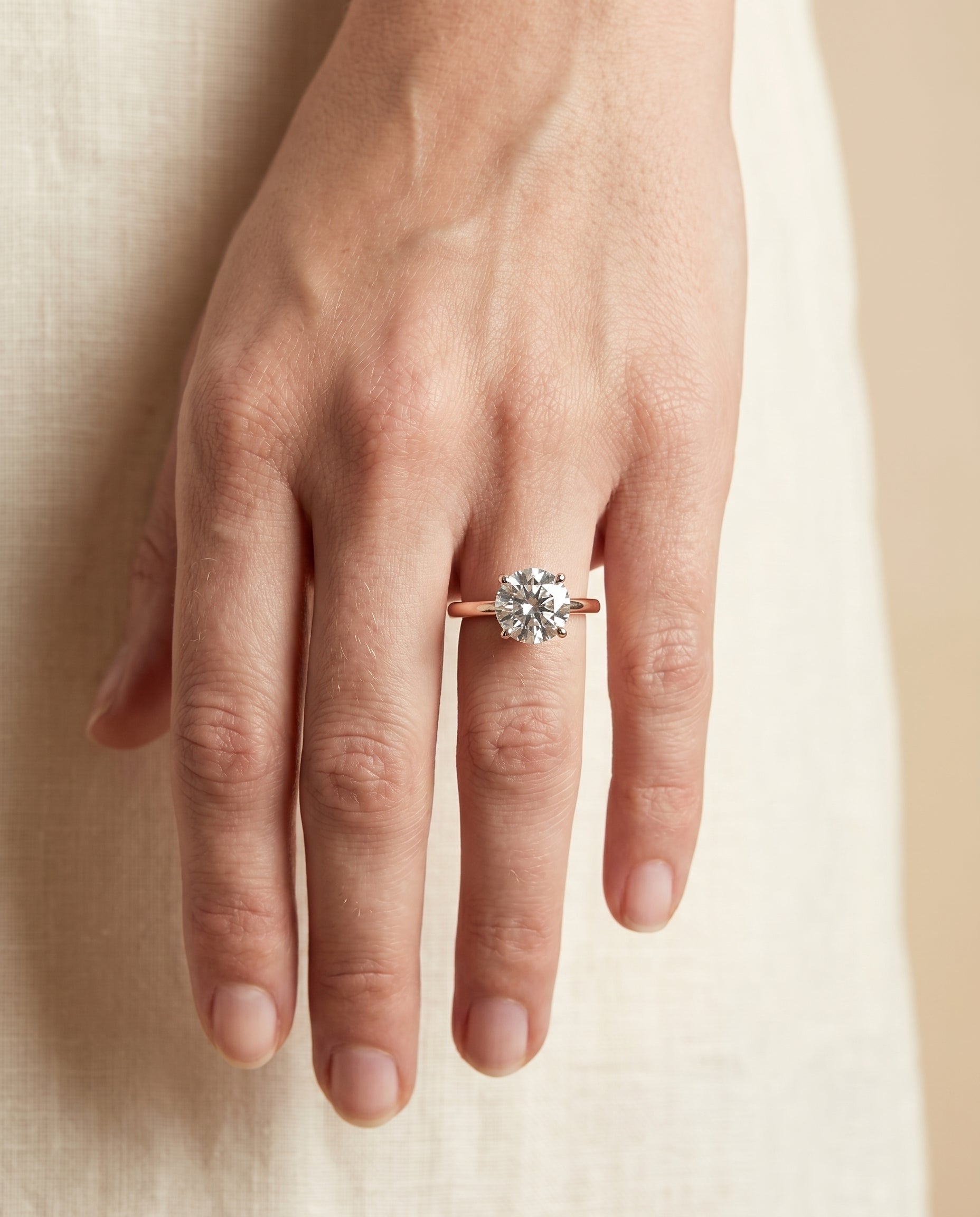 The Cyndi engagement ring setting in 14K Rose Gold, curved hidden halo solitaire design | RockHer