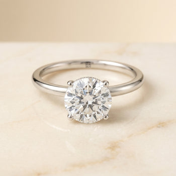 The Dolly Double Hidden Halo Solitaire Round Engagement Ring Setting in Platinum