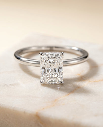Dolly Select Double Hidden Halo Solitaire Radiant Cut Lab Diamond Engagement Ring in 18K White Gold, shown on hand, angled | RockHer