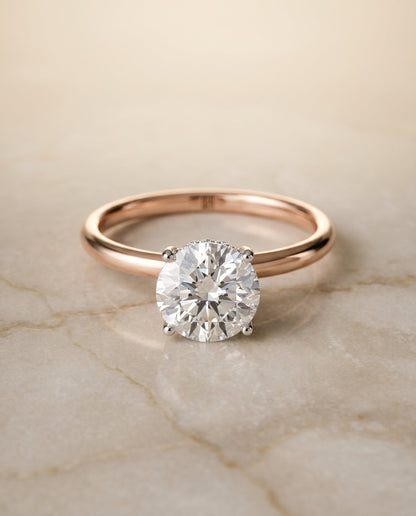 Dolly Select Double Hidden Halo Solitaire Round Lab Diamond Engagement Ring in 14K Rose Gold, shown on hand, angled | RockHer
