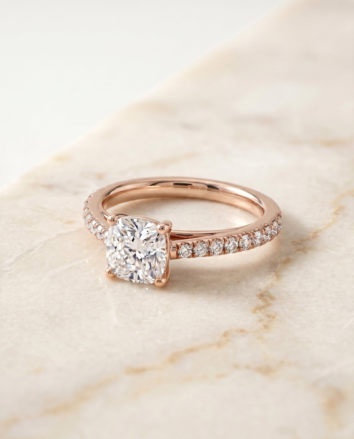 Donna Select Cathedral Cushion Cut Lab Diamond Engagement Ring in 14K Rose Gold, shown on hand, angled | RockHer