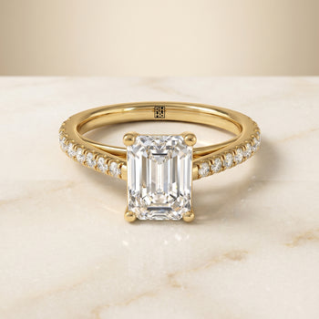 The Donna Cathedral French Pavé Solitaire Emerald Cut Engagement Ring Setting in 18K Yellow Gold