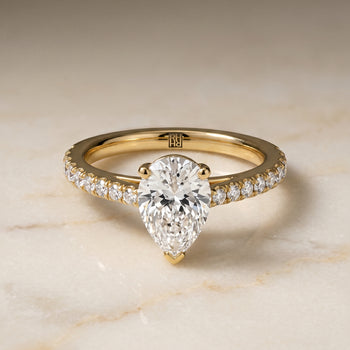 The Donna Cathedral French Pavé Solitaire Pear Engagement Ring Setting in 18K Yellow Gold