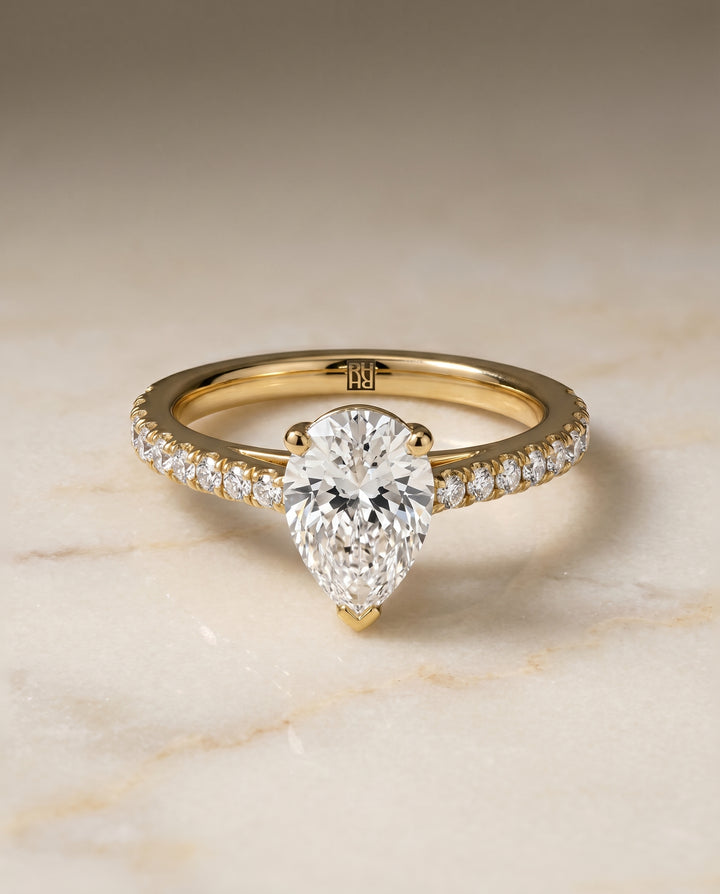 The Donna Cathedral French Pavé Solitaire Pear Engagement Ring Setting in 18K Yellow Gold