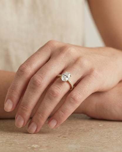 The Donna Cathedral French Pavé Solitaire Oval Engagement Ring Setting in 18K Yellow Gold