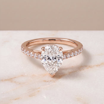 The Donna Cathedral French Pavé Solitaire Pear Engagement Ring Setting in 14K Rose Gold