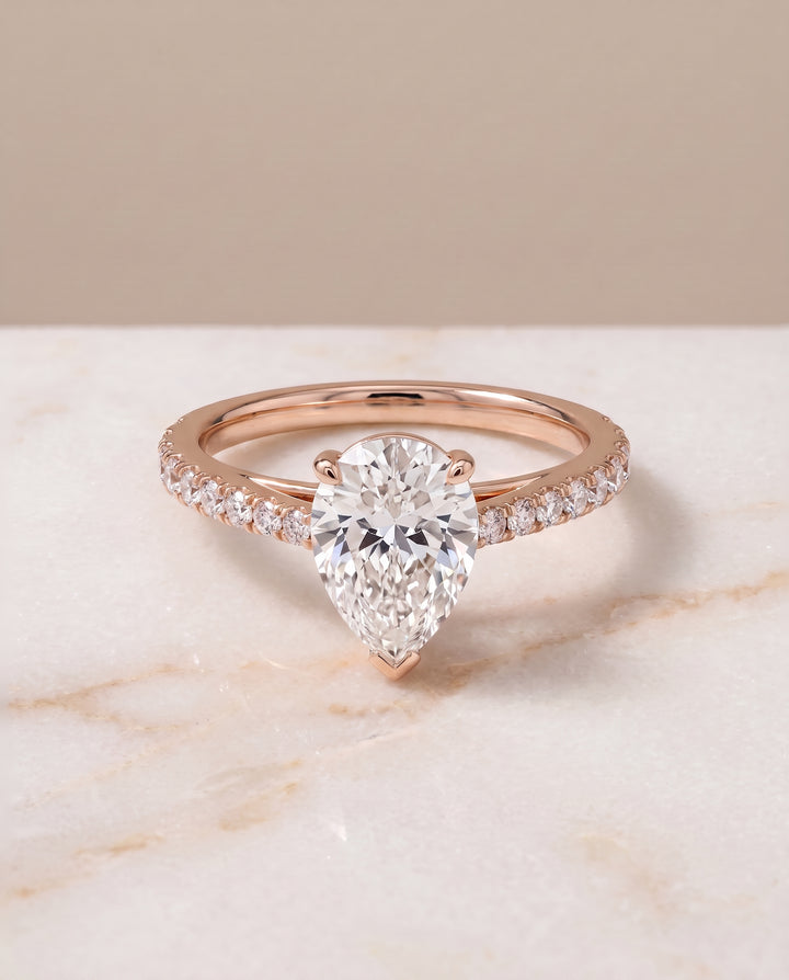 The Donna Cathedral French Pavé Solitaire Pear Engagement Ring Setting in 14K Rose Gold