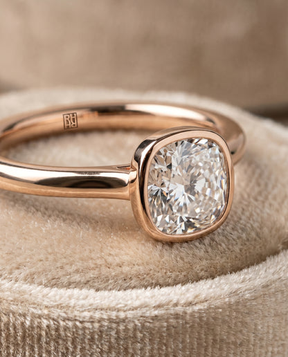 The Duran Simple Bezel Solitaire Cushion Cut Engagement Ring Setting in 14K Rose Gold