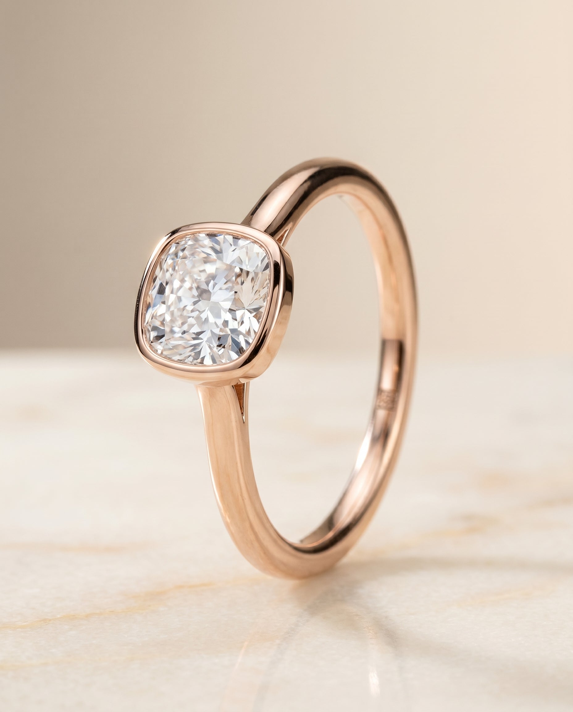 Simple Bezel Solitaire Cut styling on The Duran cushion engagement ring setting | RockHer