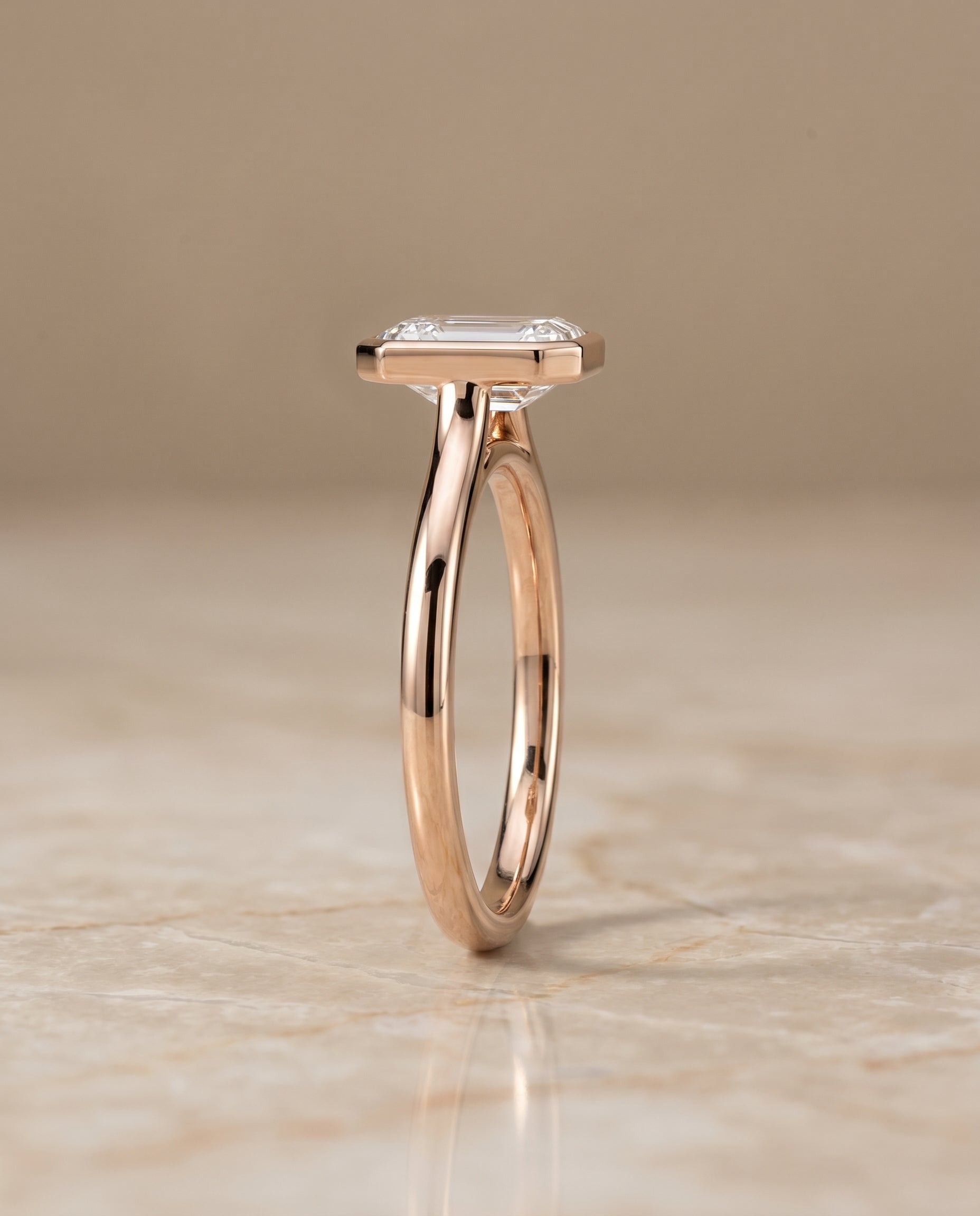 Simple Bezel Solitaire Cut styling on The Duran emerald engagement ring setting | RockHer