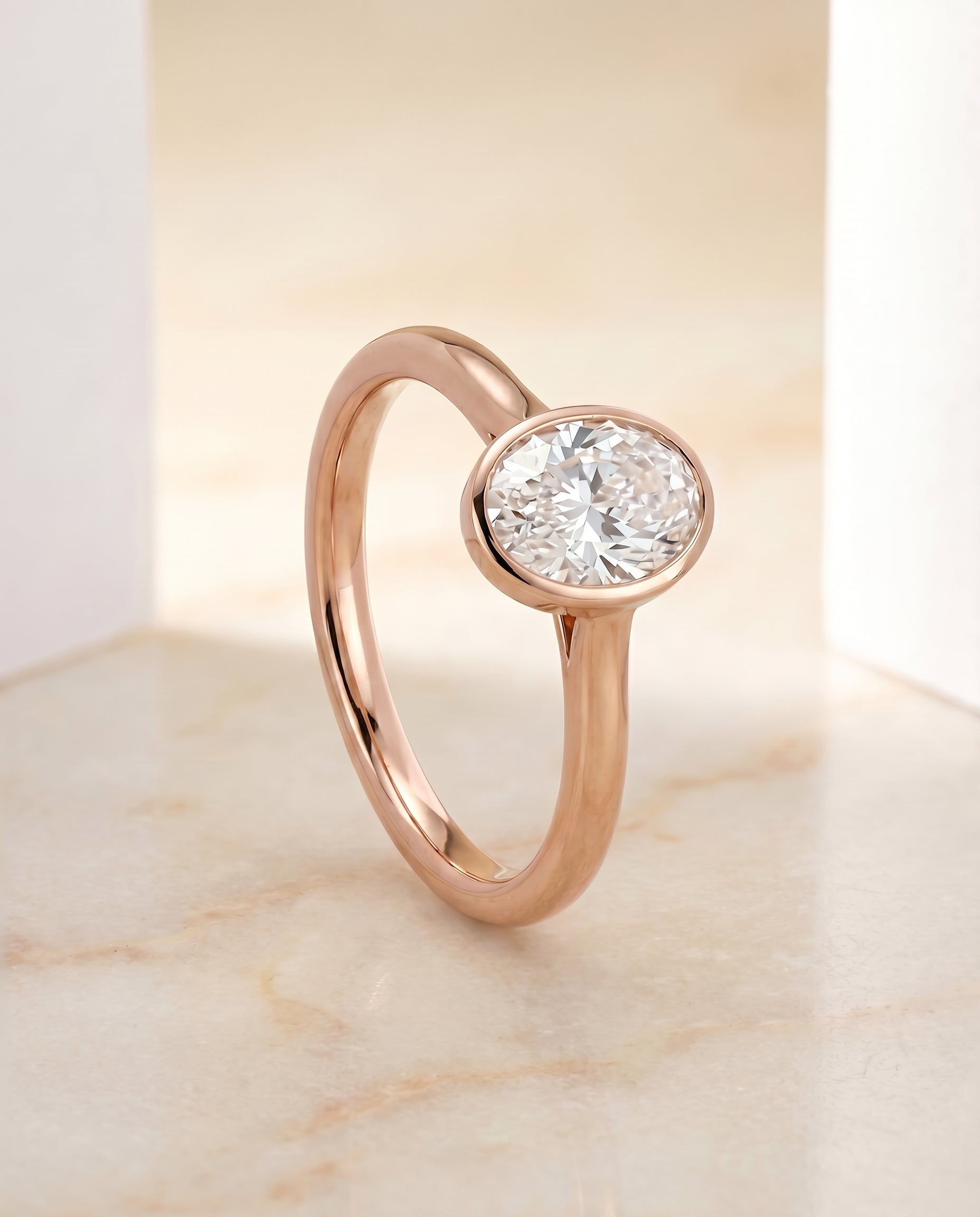 Simple Bezel Solitaire styling on The Duran oval engagement ring setting | RockHer
