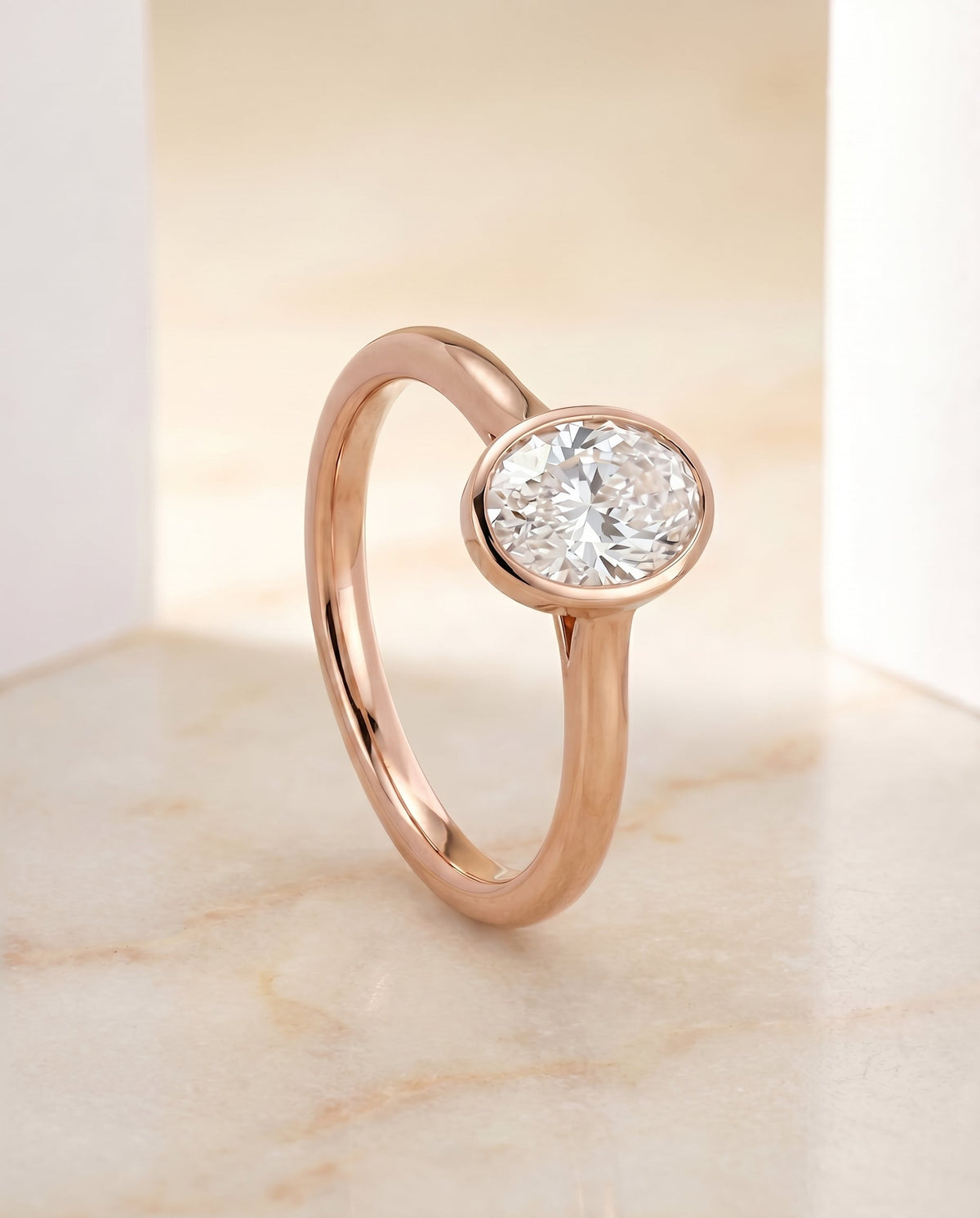 Duran Select Simple Bezel Solitaire Oval Lab Diamond Engagement Ring in 14K Rose Gold, front view | RockHer