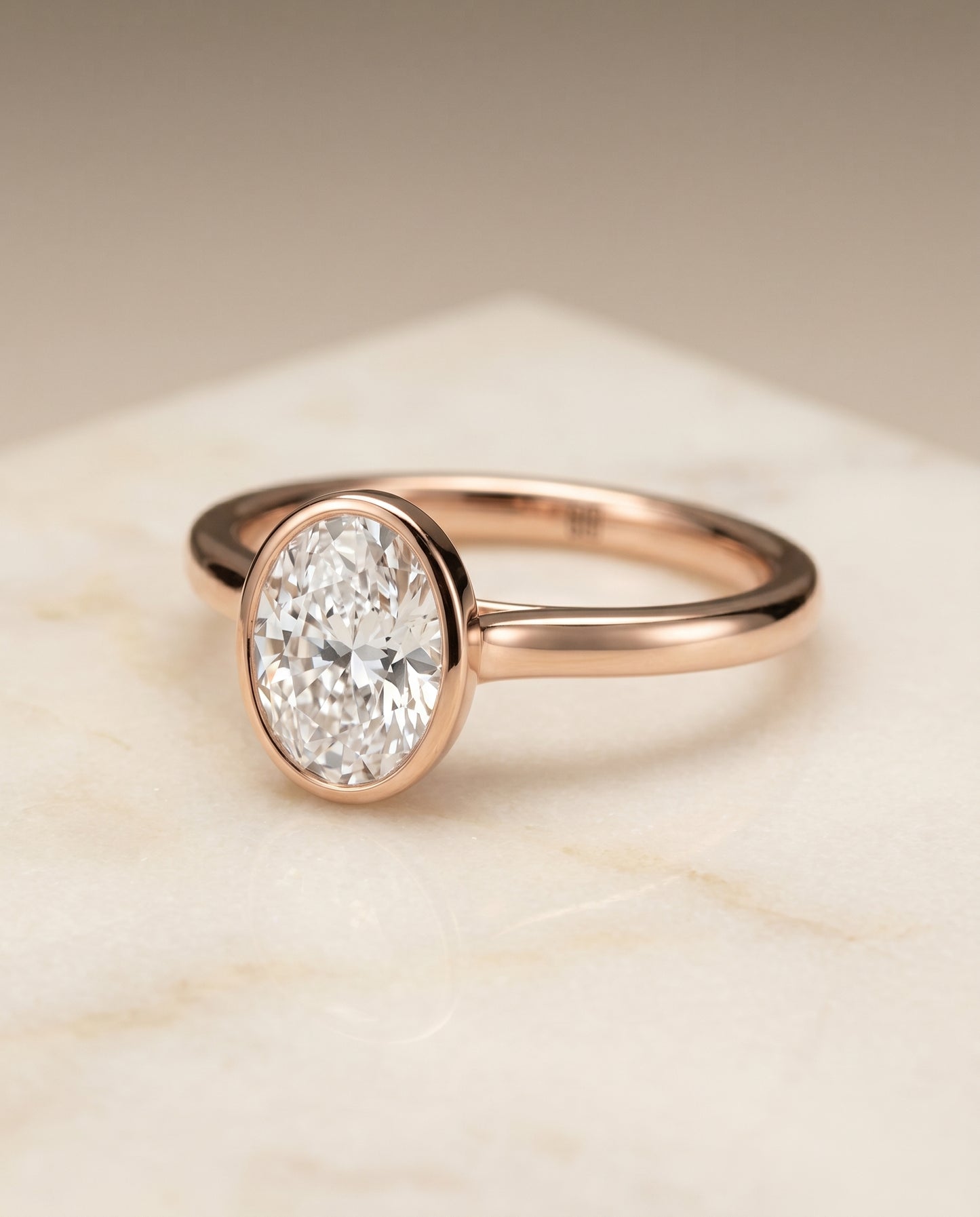 The Duran Simple Bezel Solitaire Engagement Ring Setting for Oval Diamonds in 14K Rose Gold