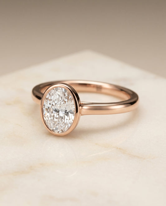 The Duran Bezel Solitaire Engagement Ring Setting for Oval Diamonds in 14K Rose Gold