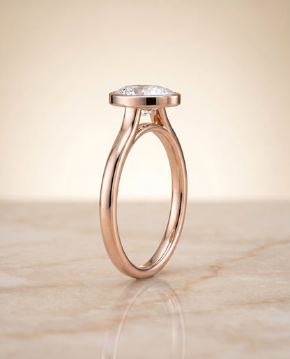The Duran Simple Bezel Solitaire Oval Engagement Ring Setting in 14K Rose Gold