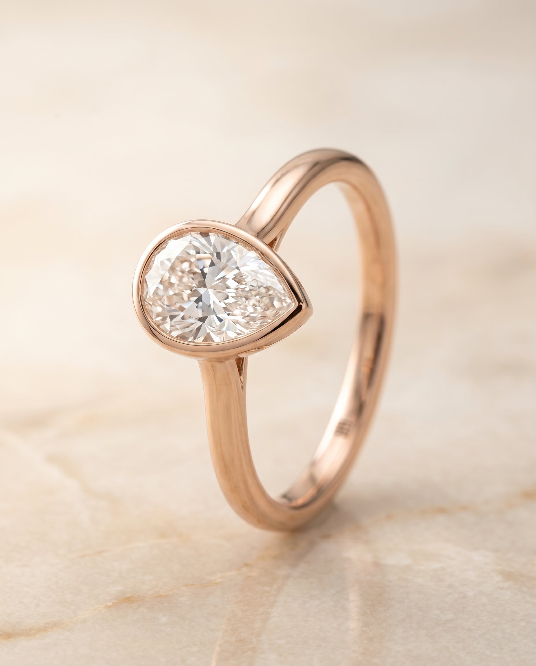 Simple Bezel Solitaire styling on The Duran pear engagement ring setting | RockHer