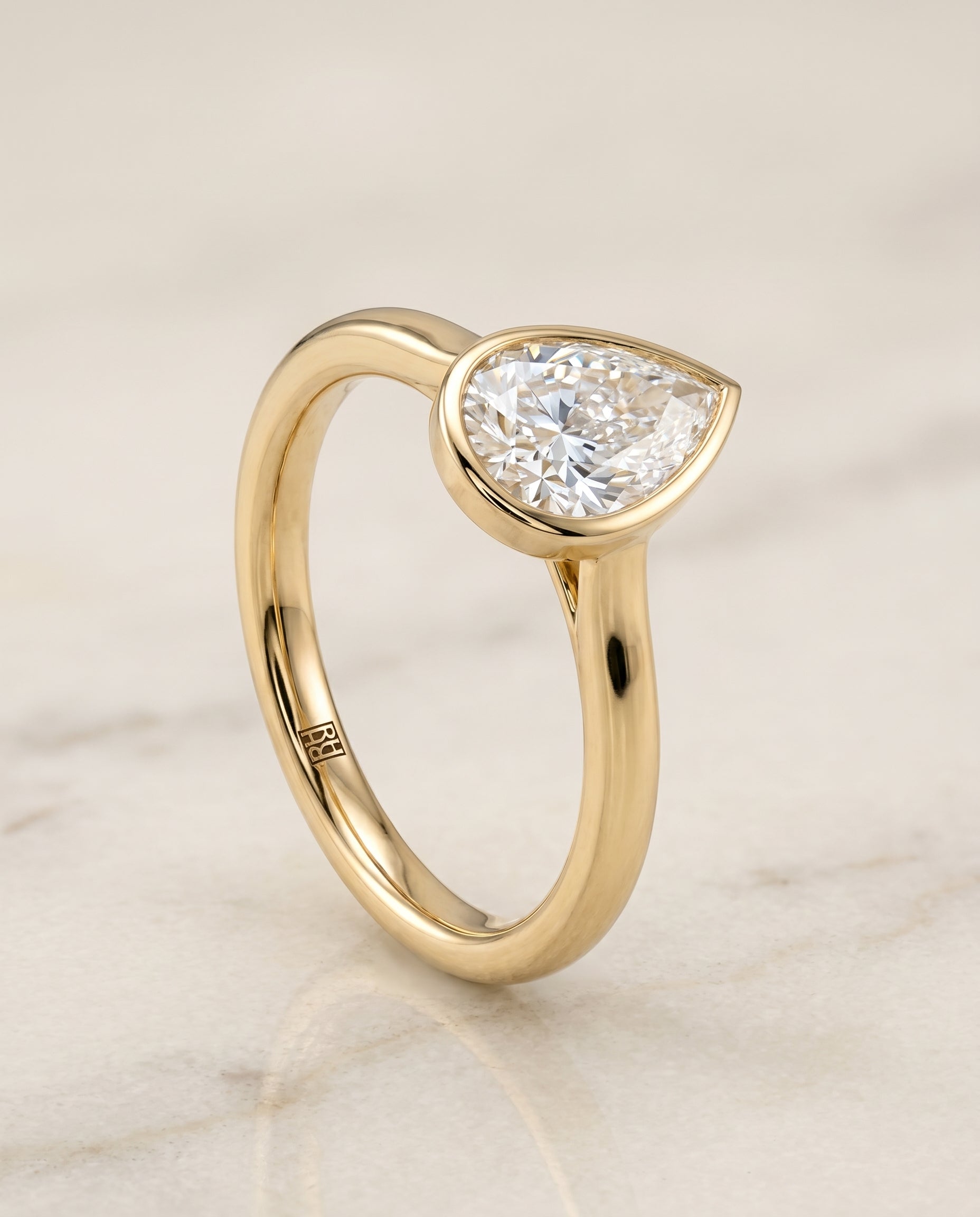 Simple Bezel Solitaire styling on The Duran pear engagement ring setting | RockHer