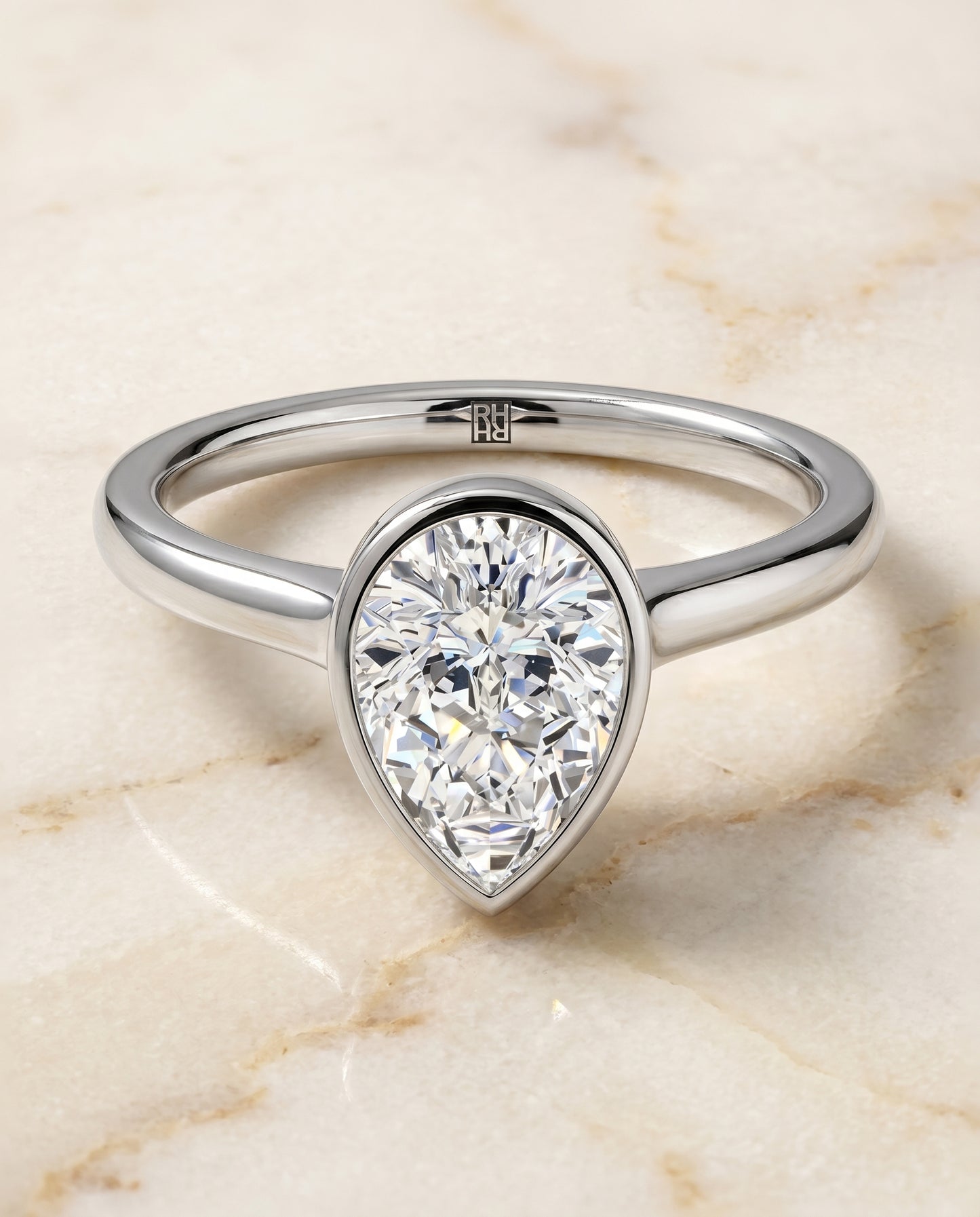 The Duran Bezel Solitaire Engagement Ring Setting for Pear Diamonds in 18K White Gold | RockHer