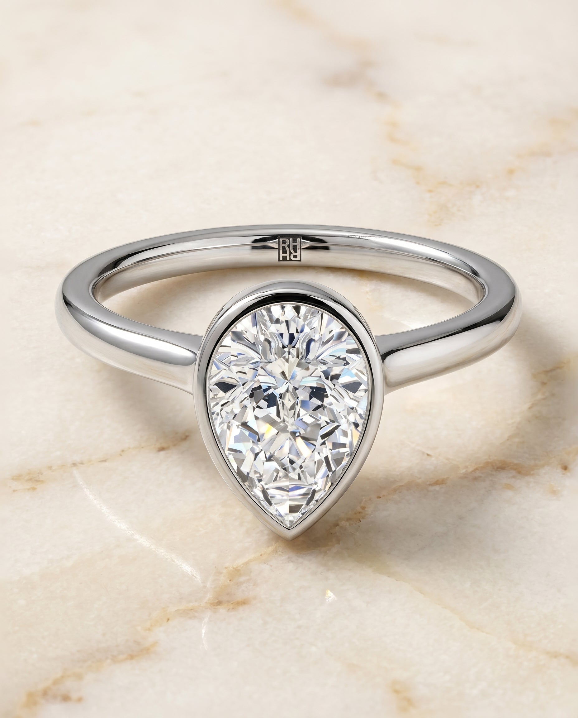 Duran Select Simple Bezel Solitaire Pear Shape in Platinum – view 1