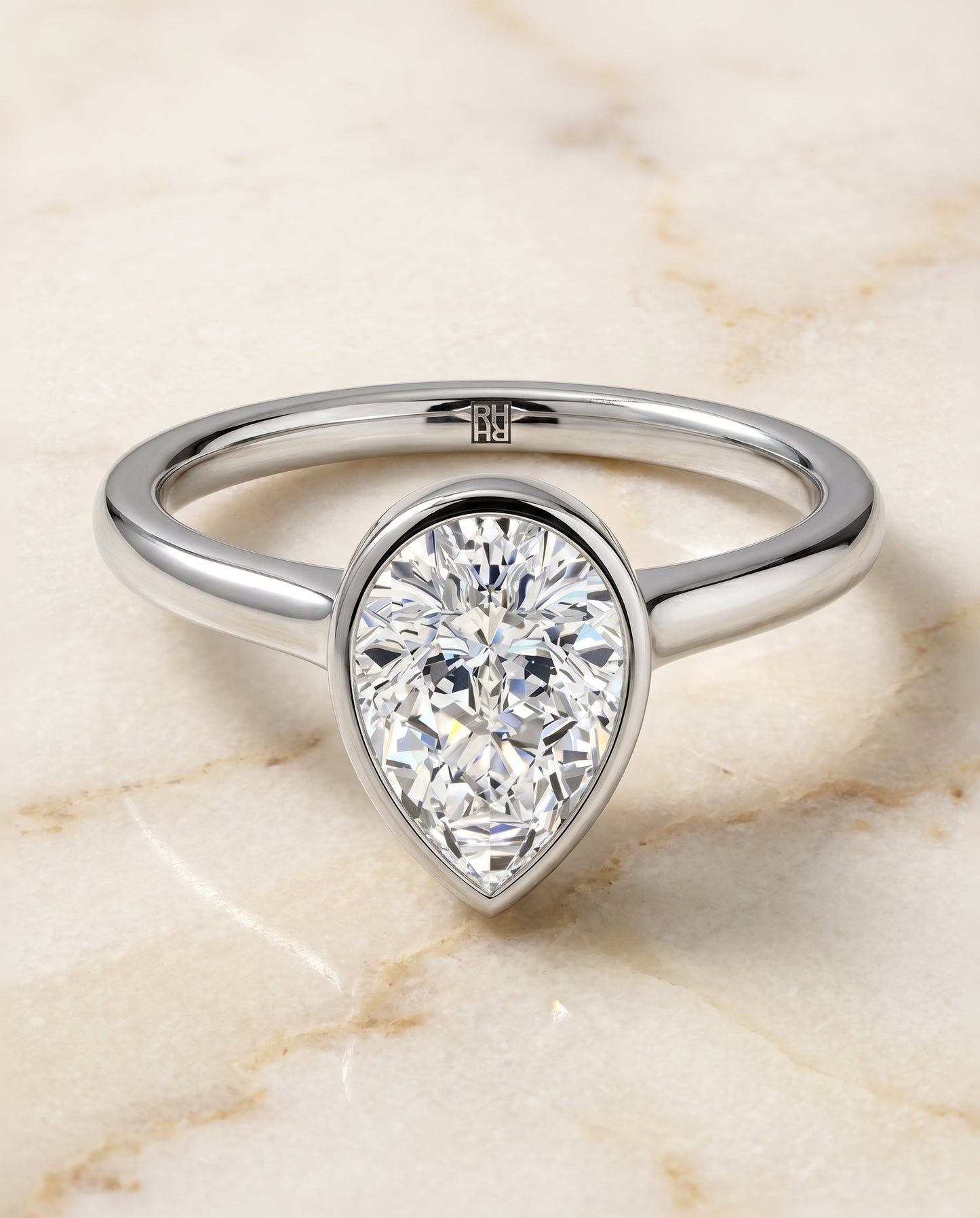 Duran Select Simple Bezel Solitaire Pear Shape in Platinum – view 1