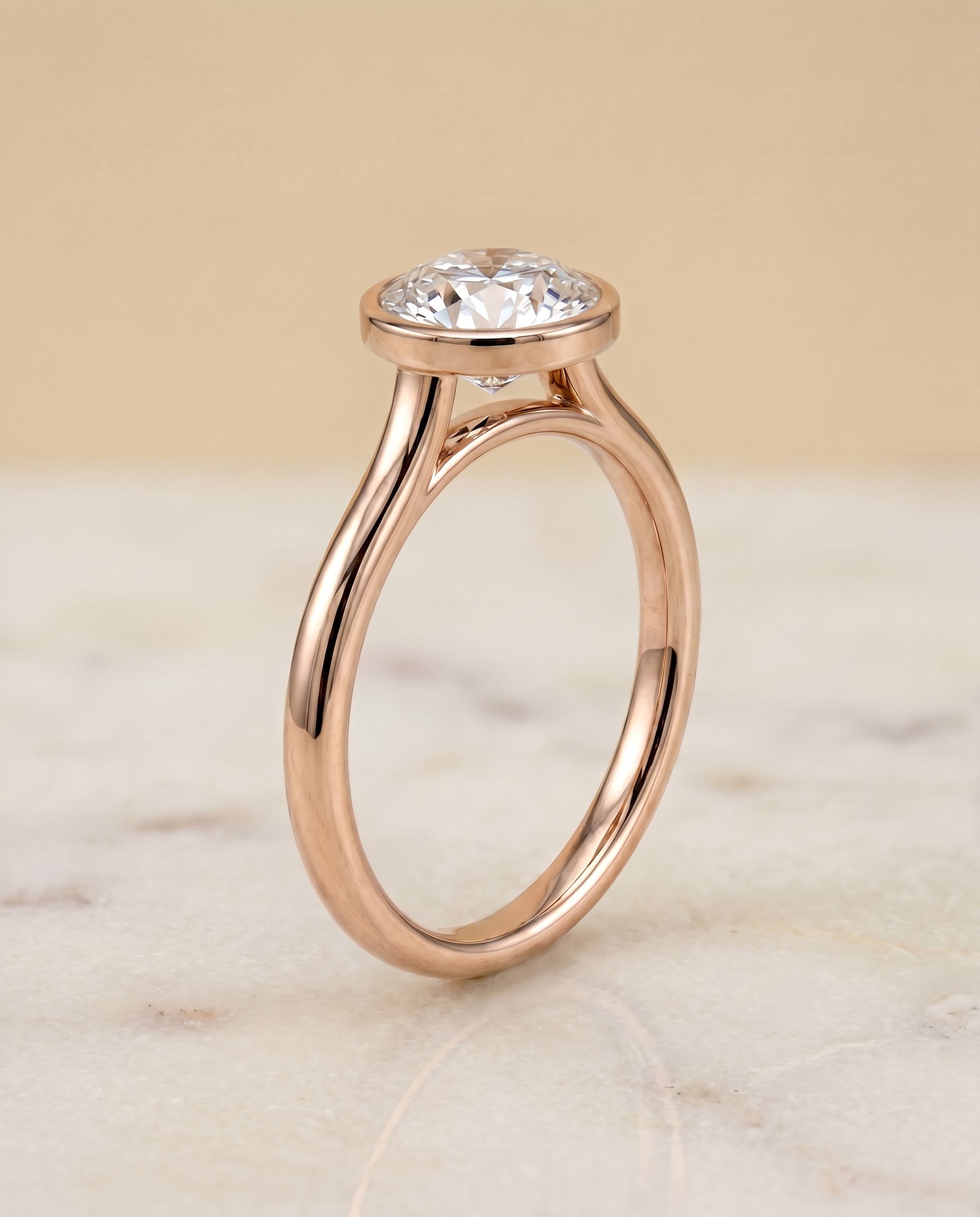 Simple Bezel Solitaire styling on The Duran round engagement ring setting | RockHer