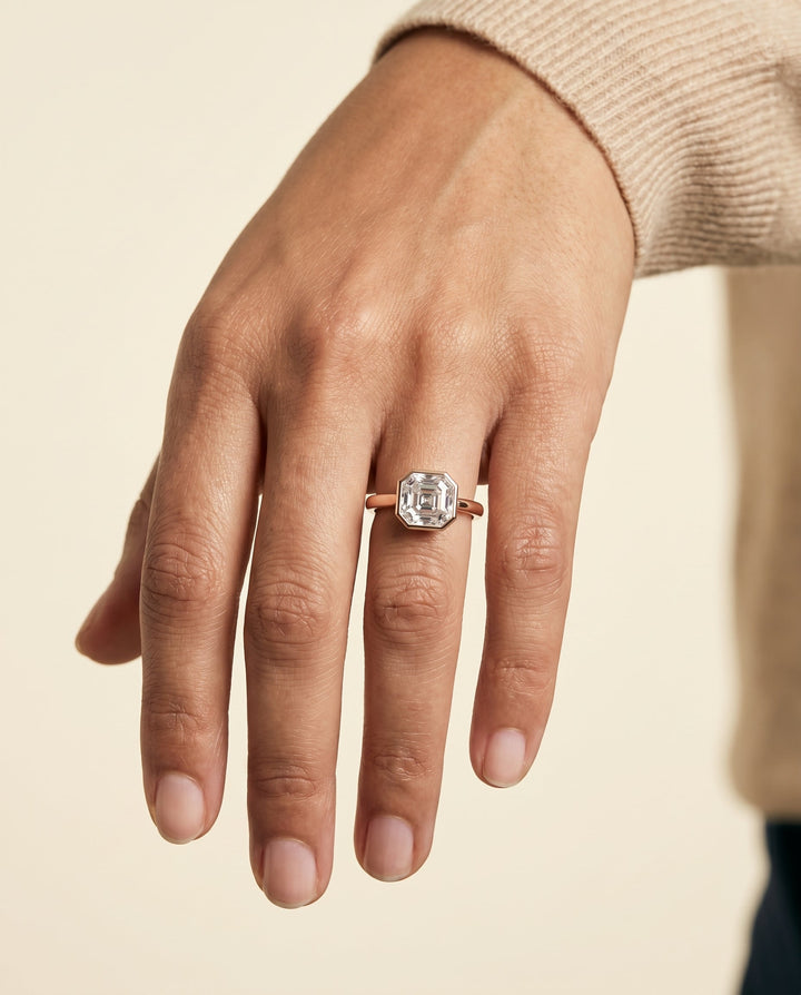 Duran Select Simple Bezel Solitaire Asscher Cut Lab Diamond Engagement Ring in 14K Rose Gold, shown on hand | RockHer