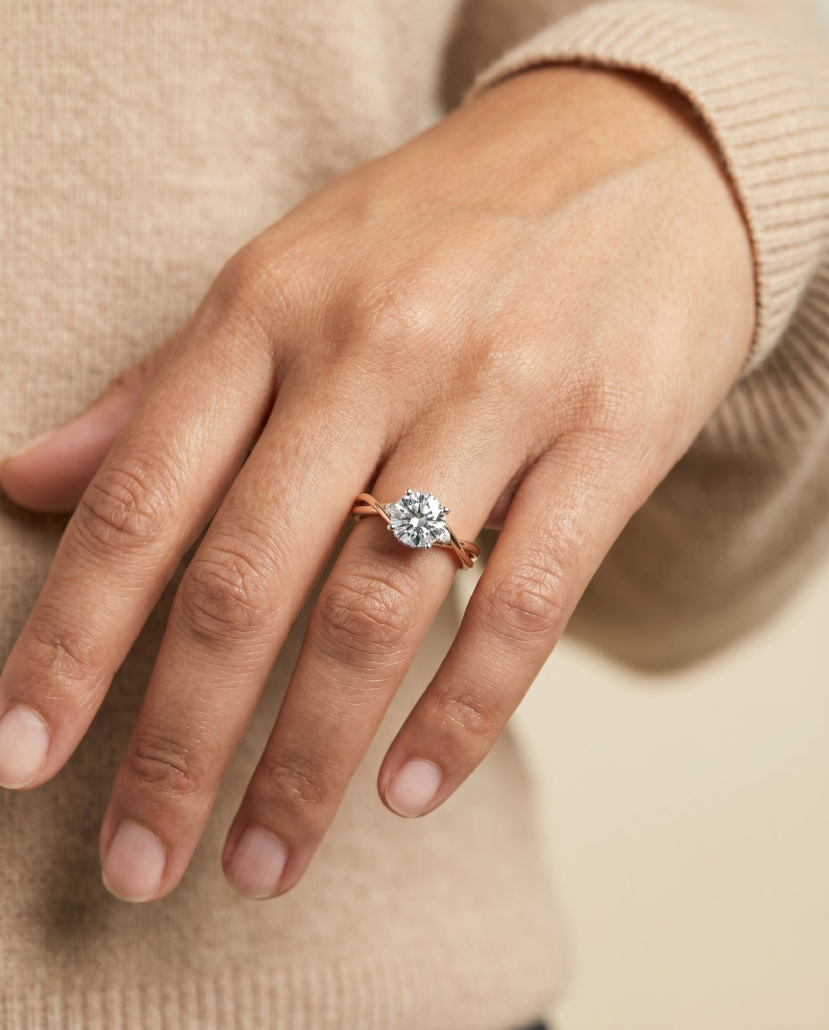 Dusty Select Hidden Halo Solitaire Round Lab Diamond Engagement Ring in 14K Rose Gold, shown on hand | RockHer